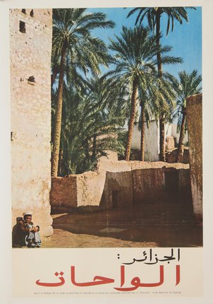 a man sitting under a stone wall