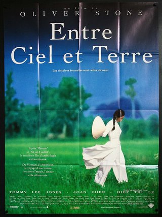 a poster of a woman walking in the grass