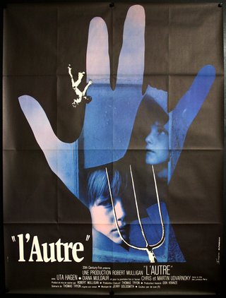 a movie poster of a child and a hand