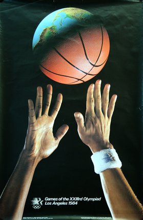 a close-up of hands reaching for a basketball