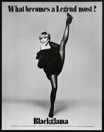 Shirley MacLaine in a fur coat doing a high kick dance move.