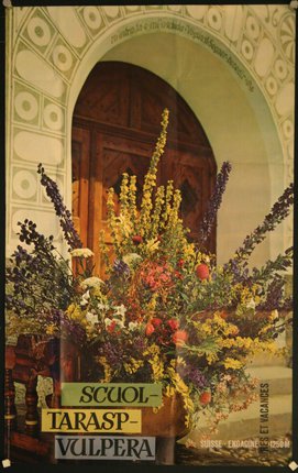 a bouquet of flowers in front of a door