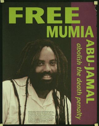 a man with dreadlocks and a white shirt