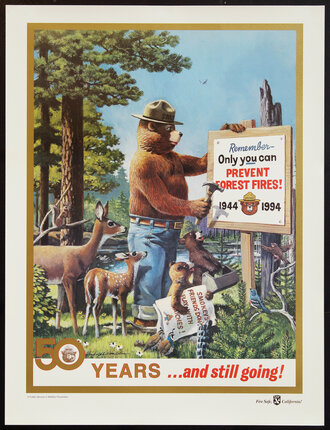 a poster of a bear holding a sign