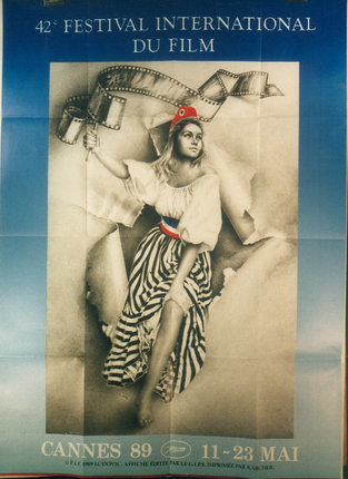 a poster of a woman holding film strips