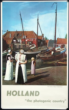 a group of women and a child looking at boats