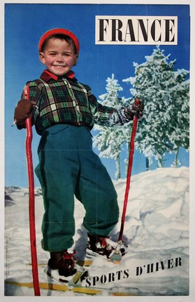 a boy on skis in the snow