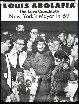 a man holding a magazine with a group of people