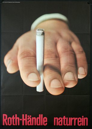 a hand holding a cigarette