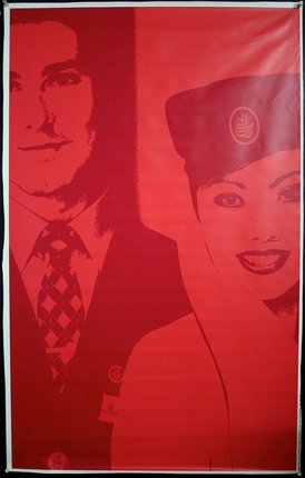 a red poster with a man and woman