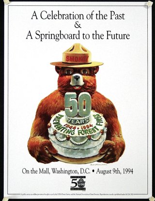 a poster of a bear holding a cake
