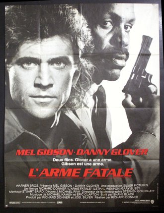 a movie poster of two men holding a gun