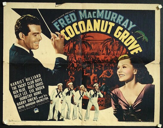 a movie poster with a man pointing a stick to a woman