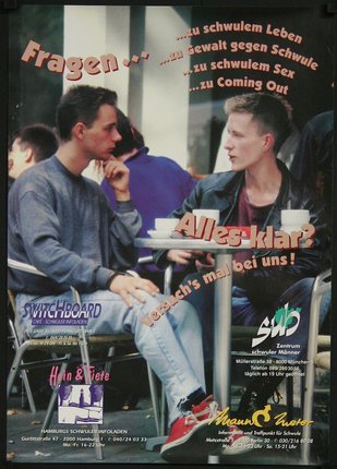 a magazine cover with two men sitting at a table