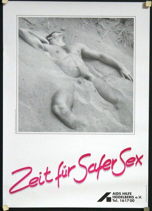 a poster of a man lying in sand