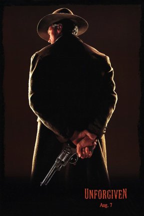 a man in a cowboy hat holding a gun