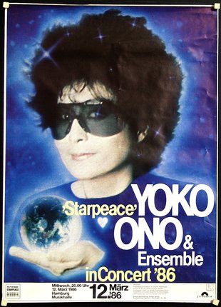 a man with afro and sunglasses holding a globe