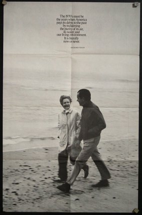a man and woman walking on a beach