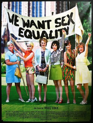 a group of women holding a banner