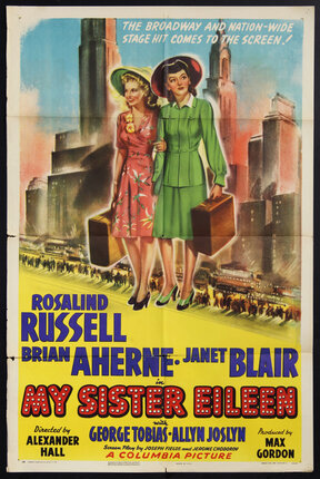 a movie poster of two women holding luggage