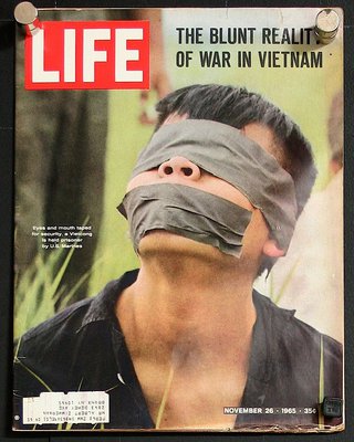a man with tape over his eyes