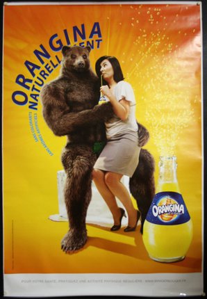 a poster of a bear and a woman