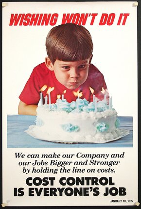 a boy blowing out candles on a cake