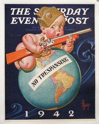 a baby holding a gun on top of a globe