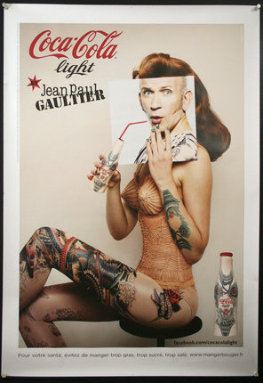 a poster of a woman holding a picture of a man with tattoos