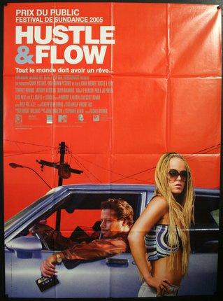 a movie poster of a man and woman in a car
