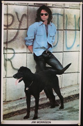 a man leaning against a wall with a dog