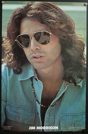 a man with long hair wearing sunglasses