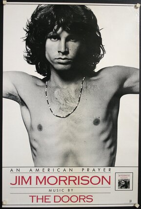 a man with long hair and a necklace