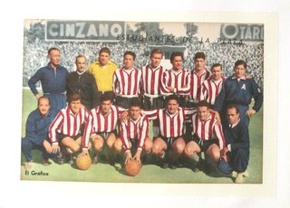 a group of football players posing for a photo