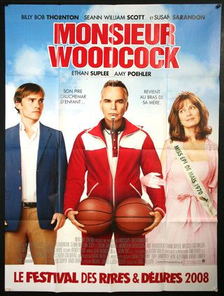 a movie poster of a man holding basketballs