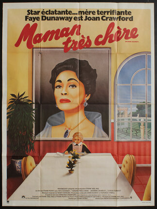 a poster of a woman sitting at a table