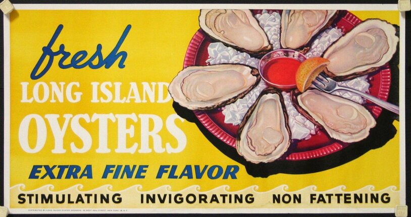 a plate of oysters with a lemon wedge on it