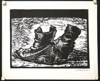 a black and white picture of a pair of boots