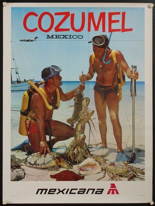 a couple of men in scuba gear on a beach