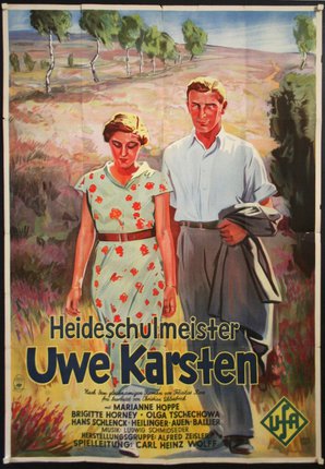 a poster of a man and woman walking in a field