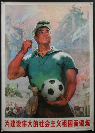 a man holding a football ball