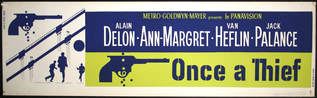a blue and green sign with a gun
