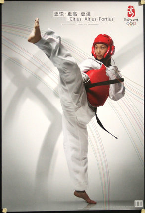 a person wearing a karate uniform and a red helmet