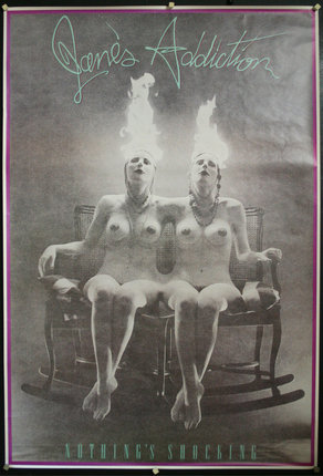 a group of women sitting on a rocking chair with flames on their head