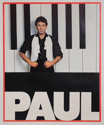 a man standing in front of a piano