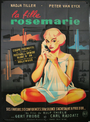 a poster of a woman sitting on the floor