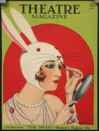 a woman wearing a rabbit hat and holding a mirror