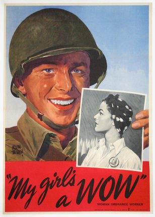 a man in a helmet holding a picture of a woman