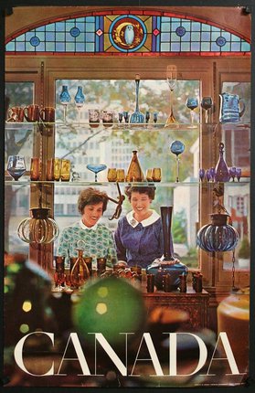 women standing in front of a window with glass objects