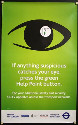 a green poster with a black eye and white text